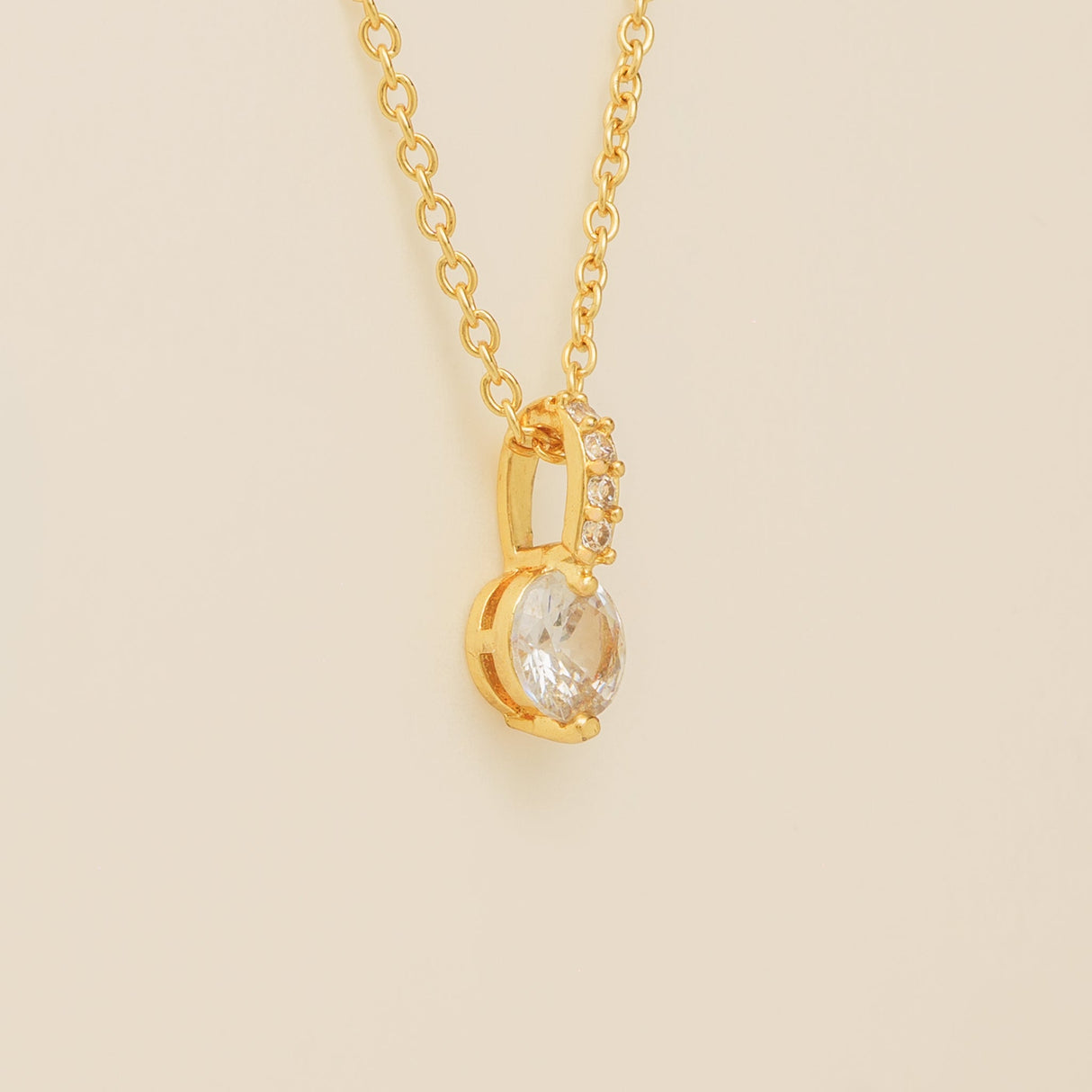 Close up of the Elegant Wishes gold crystal pendant and fine chain