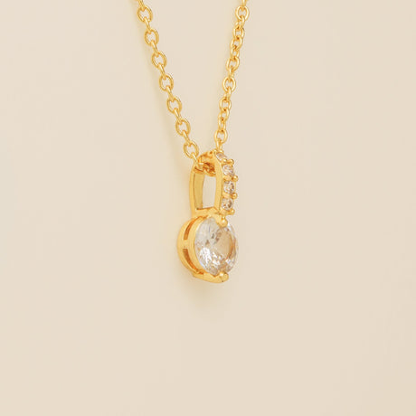 Close up of the Elegant Wishes gold crystal pendant and fine chain
