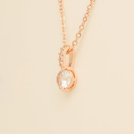 Close up of the Elegant Wishes rose gold crystal pendant and fine chain