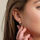 Bride wearing an Elegant Wishes gold crystal drop earring