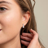 Bride wearing an Elegant Wishes silver crystal drop earring
