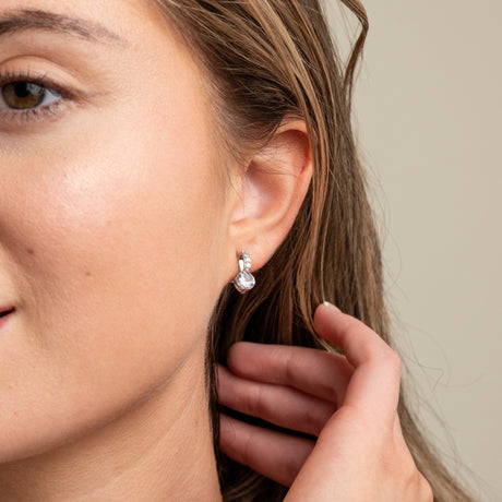 Bride wearing an Elegant Wishes silver crystal drop earring